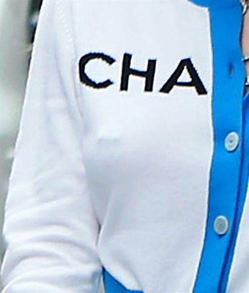 Bella Thorne Pictures Bella Thorne braless tits seen by paparazzi showing her pierced nipple dressed all in Chanel.