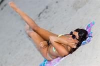 Claudia Romani sexy doing yoga at the beach in a thong bikini showing off her boobs and ass seen by paparazzi.




















