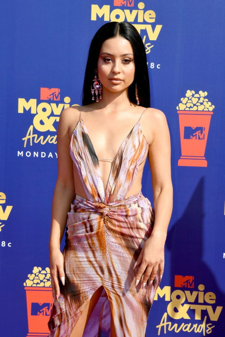 Alexa Demie Pictures Alexa Demie braless boobs in a revealing dress on the red carpet at the 2019 MTV Movie and TV Awards.