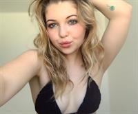 Sammi Hanratty in a bikini taking a selfie