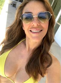 Elizabeth Hurley in a bikini taking a selfie