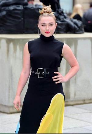 Florence Pugh braless tits pokies in a black dress.















