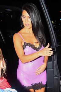 Kourtney Kardashian sexy see through pink mini dress showing her braless boobs and ass in a thong.


