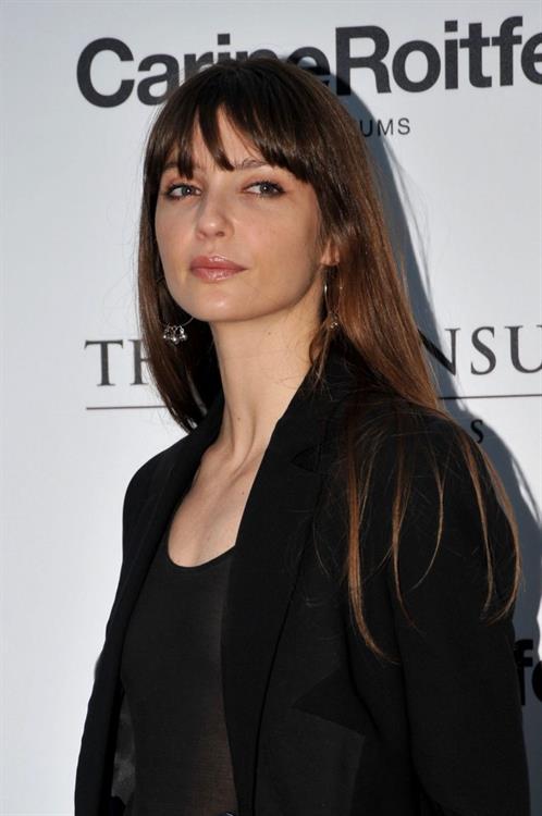 Annabelle Belmondo Pictures Annabelle Belmondo braless tits in a see through top.