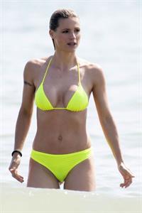 Michelle Hunziker areola peek sexy perfect body in a bikini at the beach seen by paparazzi.
















