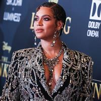 Beyonce braless boobs and areola peek showing off nice cleavage on the red carpet for the premiere of  The Lion King .






