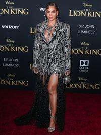 Beyonce braless boobs and areola peek showing off nice cleavage on the red carpet for the premiere of  The Lion King .






