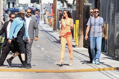 Alex Morgan braless and sexy in a orange jacket seen by paparazzi.








