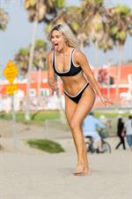 WWE Diva Lana or CJ Perry sexy boobs and ass in a bikini seen at the beach by paparazzi.










