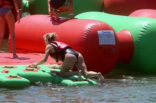 Elsa Pataky Bikini Pictures Elsa Pataky sexy ass and cleavage in a swimsuit seen by paparazzi with Chris Hemsworth.