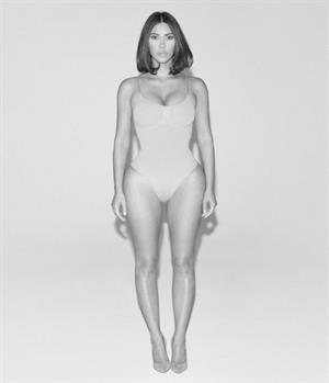 Kim Kardashian sexy new photo shoot for WSJ showing nice cleavage in her shape wear.






























