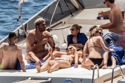 Kristen Stewart nude boobs caught topless by paparazzi tanning on a boat.
