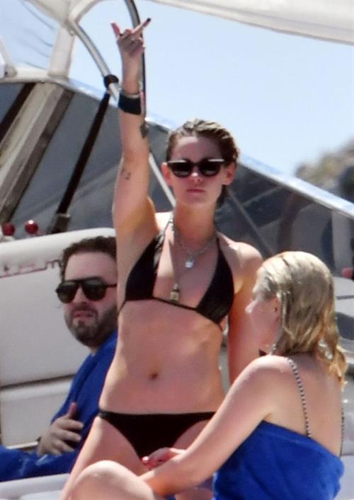 Kristen Stewart Bikini Pictures Kristen Stewart nude boobs caught topless by paparazzi tanning on a boat.