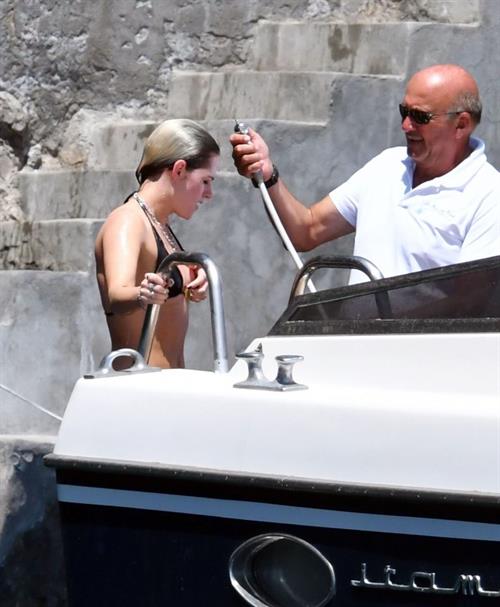 Kristen Stewart Bikini Pictures Kristen Stewart nude boobs caught topless by paparazzi tanning on a boat.