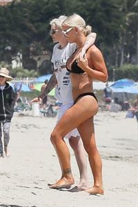 Gigi Gorgeous sexy cleavage in a bikini at the beach with Nats Getty seen by paparazzi.



