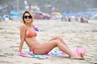 Audrina Patridge sexy ass and cleavage in a bikini seen by paparazzi at the beach.



