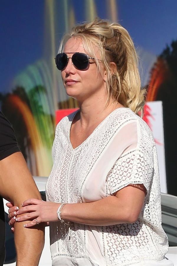 Britney Spears braless boobs in a see through blouse showing her nipples seen by paparazzi.


