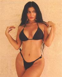 Kylie Jenner sexy boobs in a black thong bikini showing nice cleavage.















