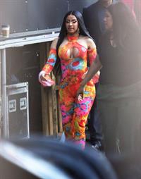 Cardi B boobs and booty on display on and off stage showing nice cleavage and her sexy ass in a tight dress.























