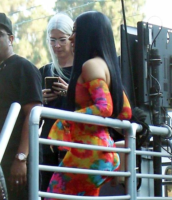 Cardi B boobs and booty on display on and off stage showing nice cleavage and her sexy ass in a tight dress.























