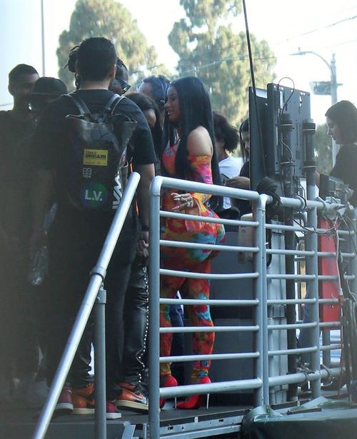 Cardi B Pictures Cardi B boobs and booty on display on and off stage showing nice cleavage and her sexy ass in a tight dress.