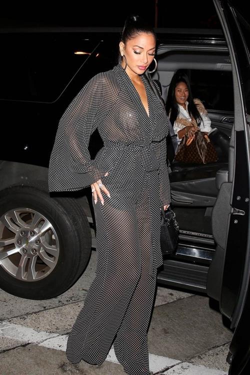 Nicole Scherzinger Pictures Nicole Scherzinger sexy in a see through outfit showing her braless boobs and ass seen by paparazzi.