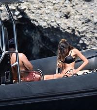 Madalina Diana Ghenea sexy ass and cleavage in a thong bikini seen by paparazzi.



