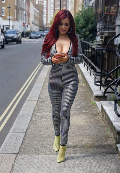 Carla Howe braless boobs showing nice cleavage in London.




