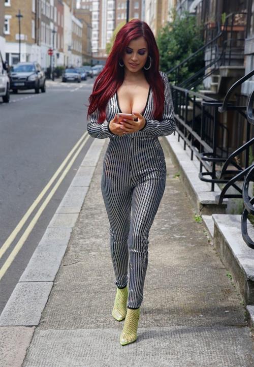 Carla Howe braless boobs showing nice cleavage in London.




