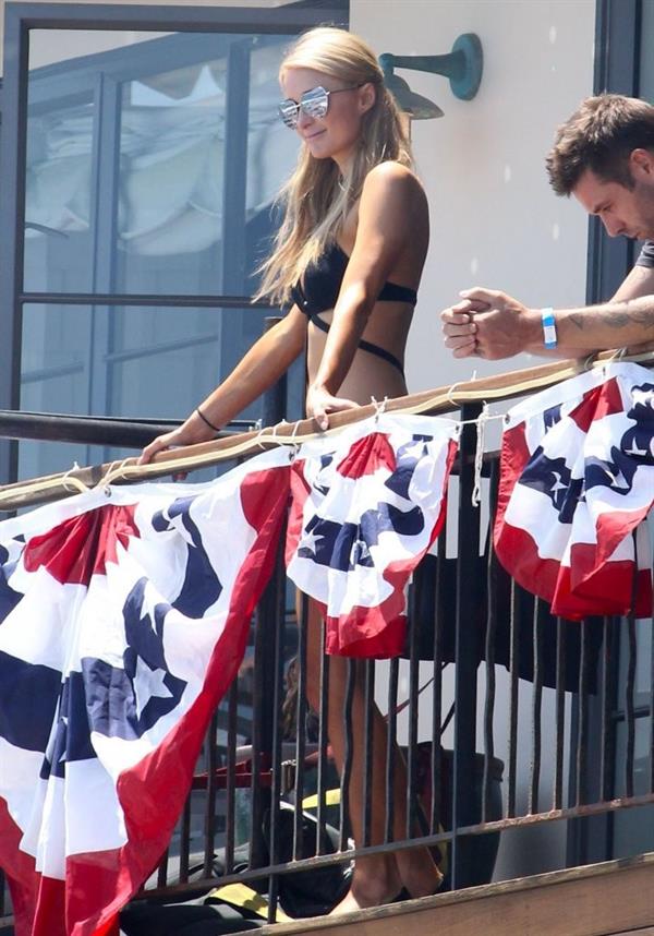 Paris Hilton on a balcony