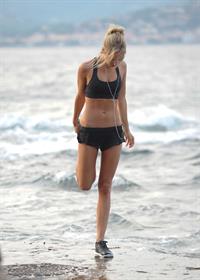 Kimberley Garner at the beach with her dog
