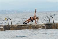 Kimberley Garner at the beach with her dog