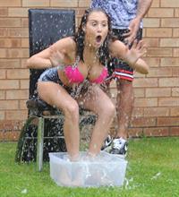 Chloe Goodman gets water dumped on her