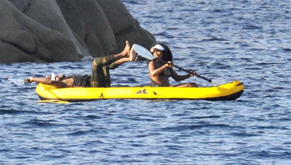 Rihanna paddle boarding