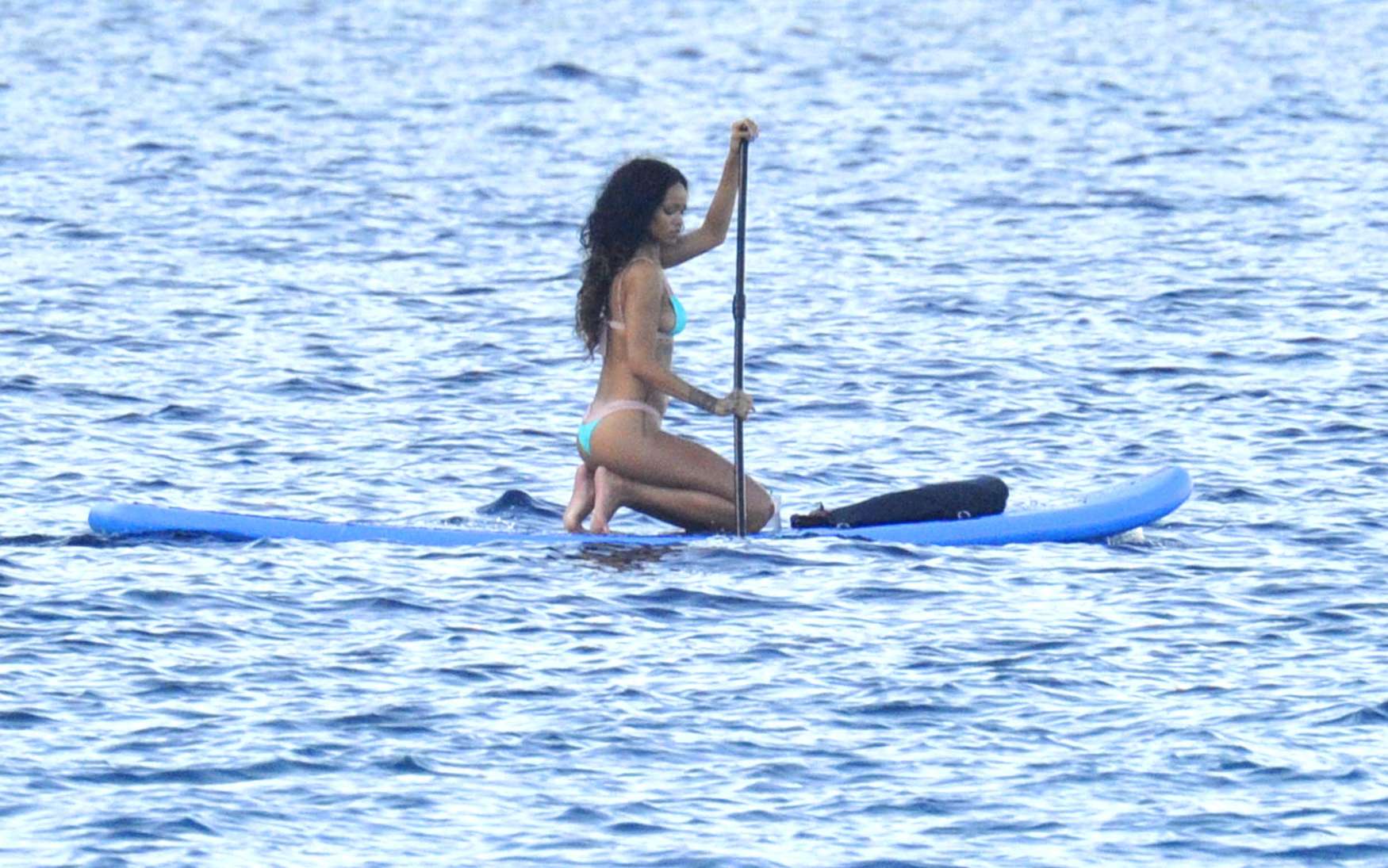 Rihanna paddle boarding