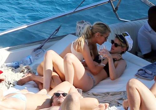 Kristen Stewart Bikini Pictures Kristen Stewart and Stella Maxwell sexy lesbians making out on a boat in bikinis seen by paparazzi.