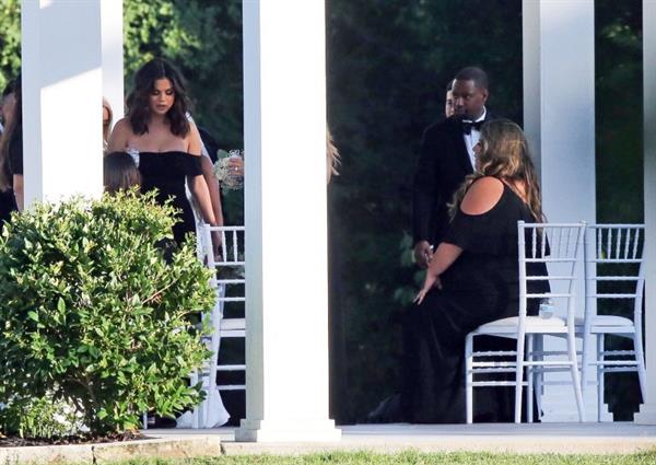 Selena Gomez sexy in a black dress for her cousins wedding showing nice cleavage seen by paparazzi.























