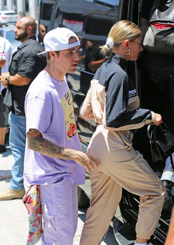 Justin Bieber and Hailey Baldwin getting into their van as he pinches her ass seen by paparazzi.






































