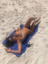 Claudia Romani nude photos at the beach showing her sexy ass and holding her topless boobs in a thong bikini.









































