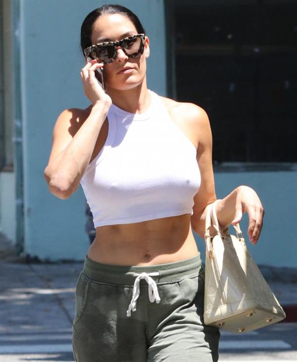 Nikki Bella braless boobs in a white top seen by paparazzi showing her tits pokies.






