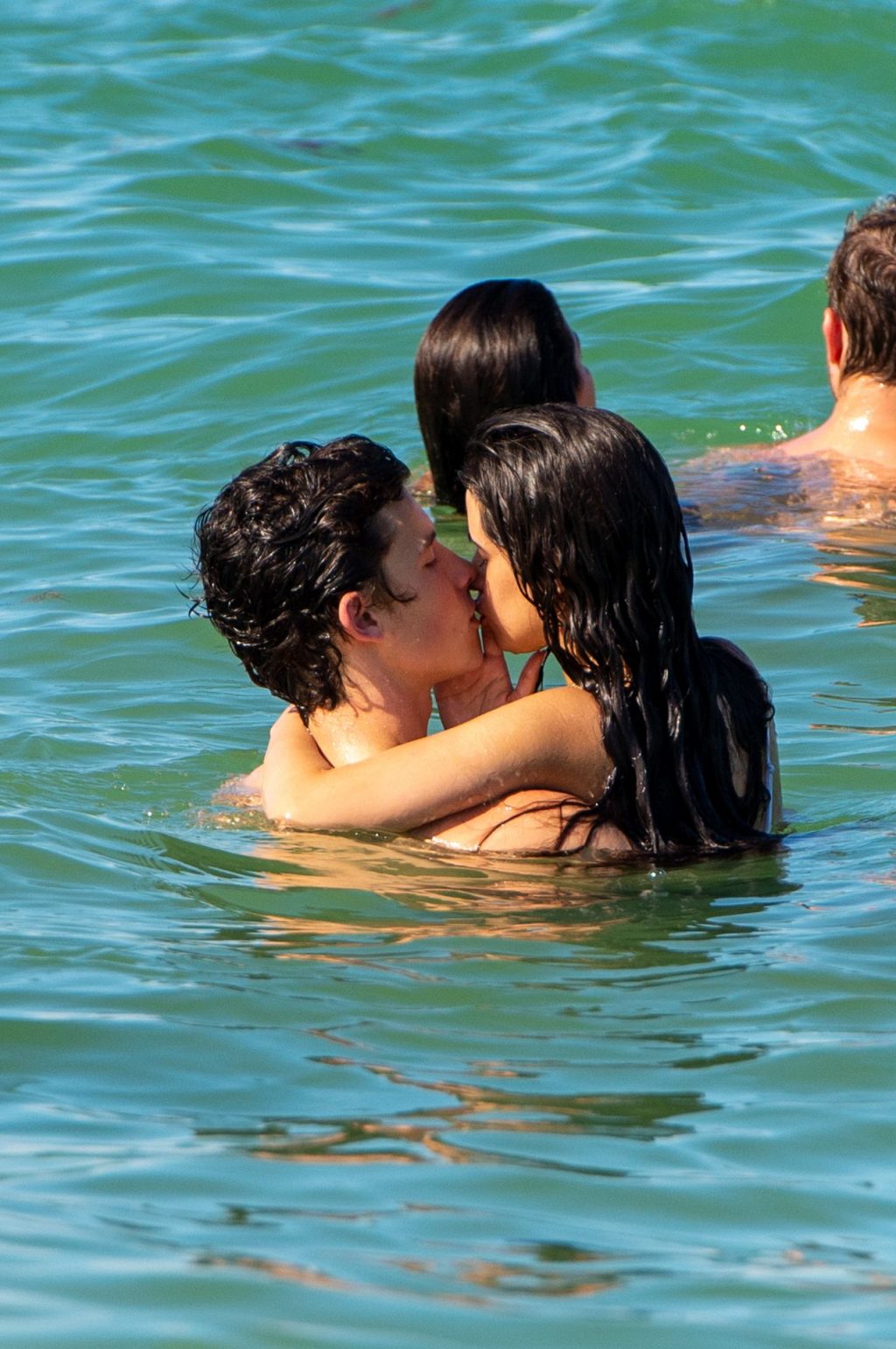 Camila Cabello and Shawn Mendes making out in the water seen kissing by paparazzi.





































