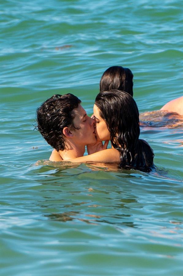 Camila Cabello and Shawn Mendes making out in the water seen by paparazzi kissing.






































