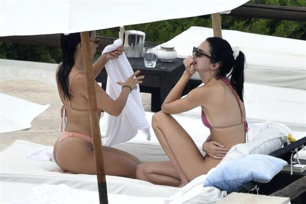 Kendall Jenner with Kourtney Kardashian sexy asses in thong bikinis seen by paparazzi.

