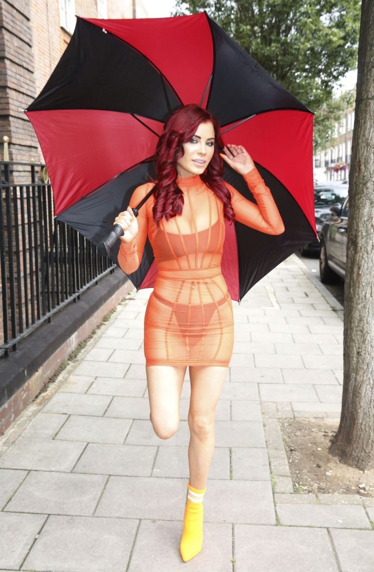 Carla Howe sexy body in a see through orange dress showing her bra and thong panties seen by paparazzi.




