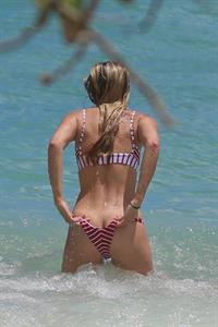 Josie Canseco Bikini Pictures Josie Canseco sexy ass in a thong bikini seen by paparazzi as a wave gives her a bit of a wardrobe malfunction flashing her ass.