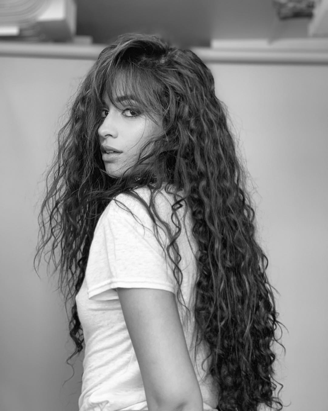 Camila Cabello Pictures Camila Cabello braless boobs in a see through white top showing her tits.