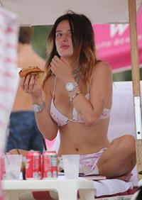 Bella Thorne areola peek in a sexy bikini at the beach seen by paparazzi.




