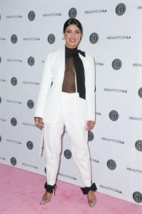 Priyanka Chopra braless boobs in a see through top showing some nice cleavage at Beautycon.

