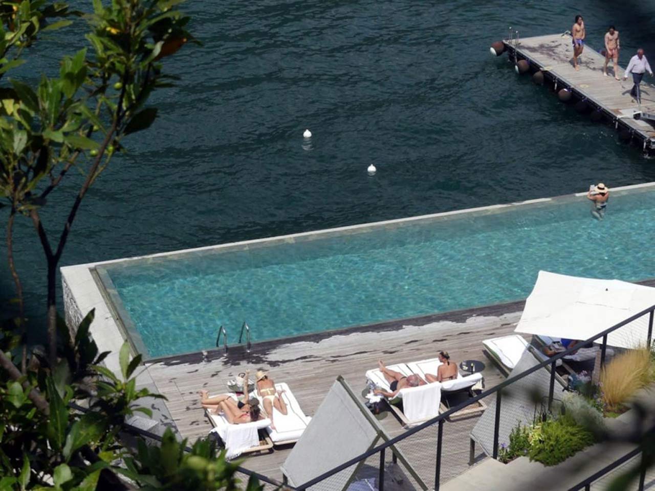 Miley Cyrus Bikini Pictures Miley Cyrus and Kaitlynn Carter making out kissing by the pool seen by paparazzi showing her lesbian side after leaving Liam Hemsworth.