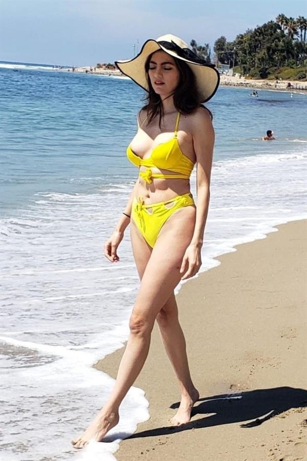 Blanca Blanco nip slip wardrobe malfunction and sexy ass in yellow thong bikini at the beach.
